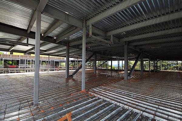interior of a building under construction with metal and rebar on the floor