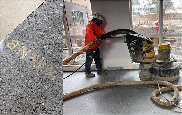 a worker uses a floor polishing machine on concrete floor in front of a window